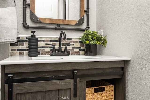 24343 Landover Rd Unit 139, Laguna Hills, CA 92653 - bathroom with decorative backsplash, vanity, and a textured wall