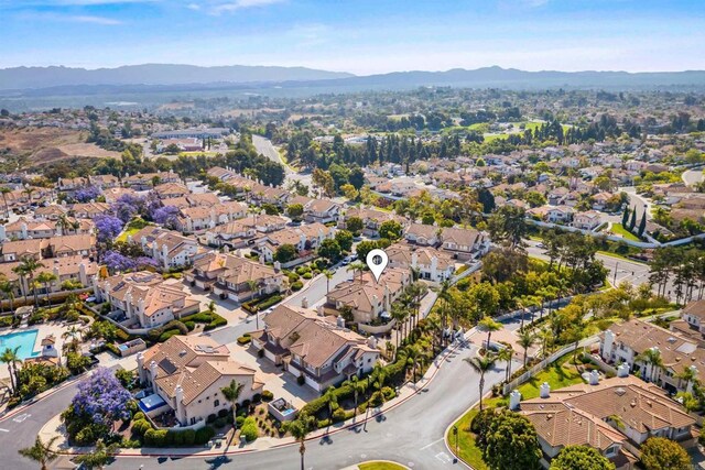 4625 Los Alamos Way Unit C, Oceanside, CA 92057 - aerial view of property's location featuring a mountainous background and nearby suburban area