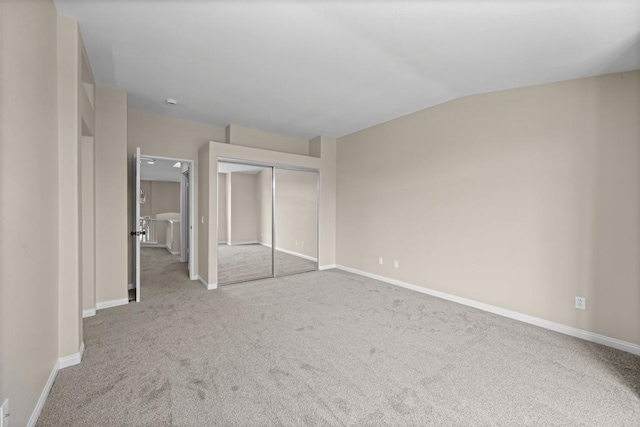 4625 Los Alamos Way Unit C, Oceanside, CA 92057 - unfurnished bedroom featuring carpet floors, a closet, and vaulted ceiling