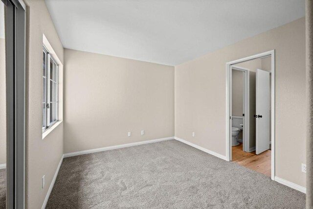 4625 Los Alamos Way Unit C, Oceanside, CA 92057 - unfurnished bedroom featuring carpet floors and ensuite bathroom