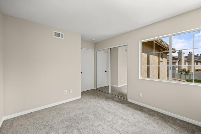 4625 Los Alamos Way Unit C, Oceanside, CA 92057 - unfurnished bedroom featuring carpet flooring and a closet