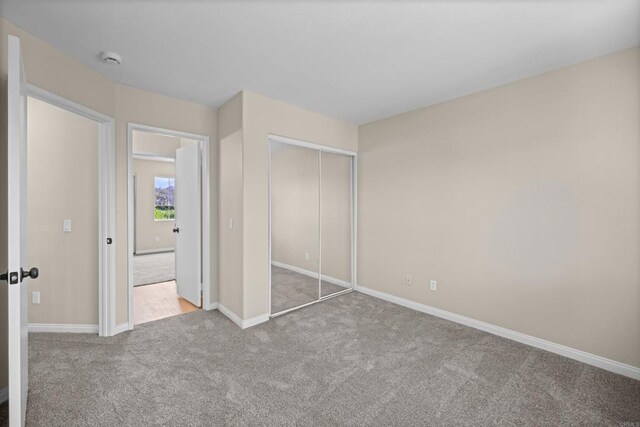 4625 Los Alamos Way Unit C, Oceanside, CA 92057 - unfurnished bedroom with carpet and a closet