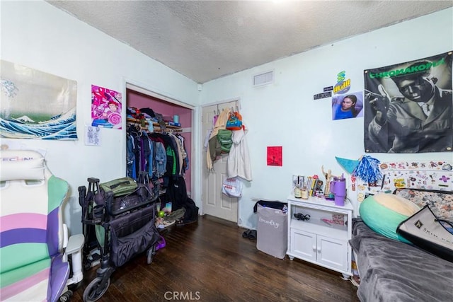 5082 La Madera Ave, El Monte, CA 91732 - bedroom with a closet, dark wood-style floors, and a textured ceiling