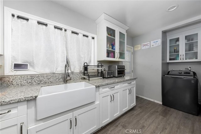 5082 La Madera Ave, El Monte, CA 91732 - kitchen featuring washer / dryer, dark wood-type flooring, white cabinets, and glass insert cabinets