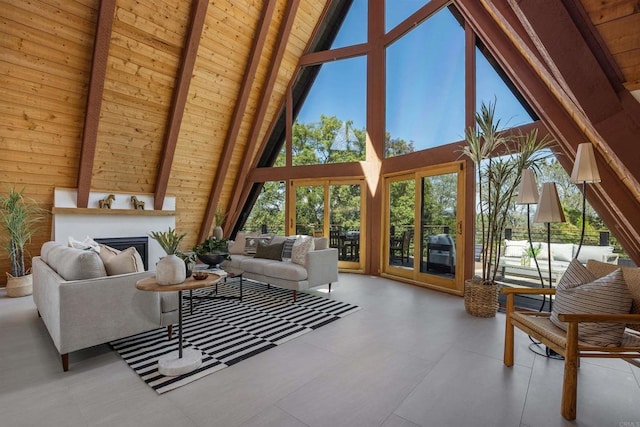 602 Sereno View Rd, Encinitas, CA 92024 - living room with high vaulted ceiling, wooden walls, a large fireplace, and a wood ceiling with exposed beams