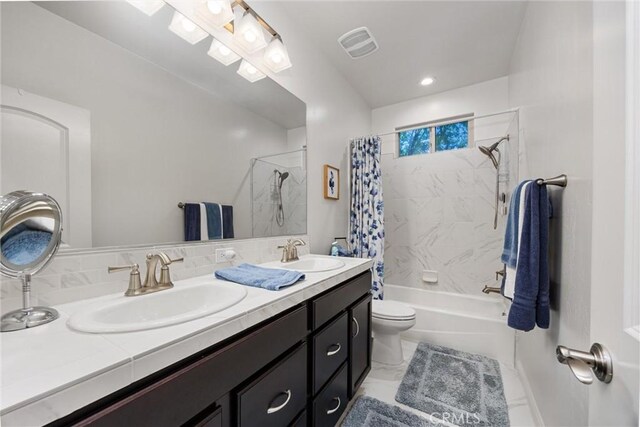 14217 Pemberley Passage Ave, Bakersfield, CA 93311 - bathroom featuring double vanity and shower / bath combo with shower curtain