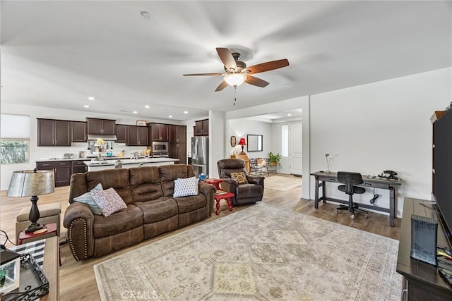 14217 Pemberley Passage Ave, Bakersfield, CA 93311 - living room featuring light wood finished floors, ceiling fan, and recessed lighting