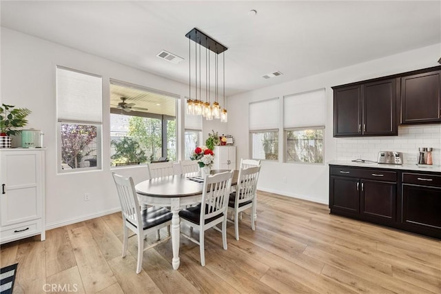 14217 Pemberley Passage Ave, Bakersfield, CA 93311 - dining room with light wood-style floors and plenty of natural light