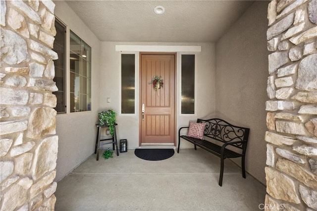 14217 Pemberley Passage Ave, Bakersfield, CA 93311 - property entrance featuring stone siding and stucco siding