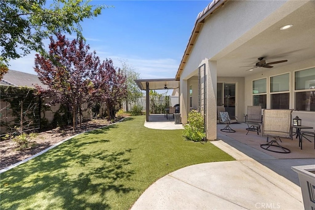 14217 Pemberley Passage Ave, Bakersfield, CA 93311 - fenced backyard with a ceiling fan and a patio