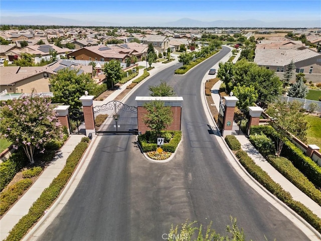 14217 Pemberley Passage Ave, Bakersfield, CA 93311 - aerial perspective of suburban area with a mountainous background