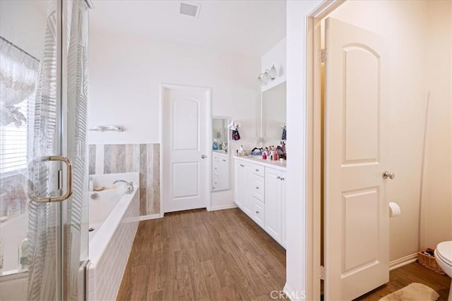 26947 Mountaingate St, Menifee, CA 92585 - full bathroom featuring wood finished floors, a garden tub, a stall shower, and vanity