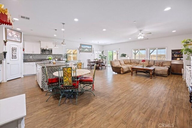 26947 Mountaingate St, Menifee, CA 92585 - dining room featuring light wood-style flooring, recessed lighting, and a ceiling fan