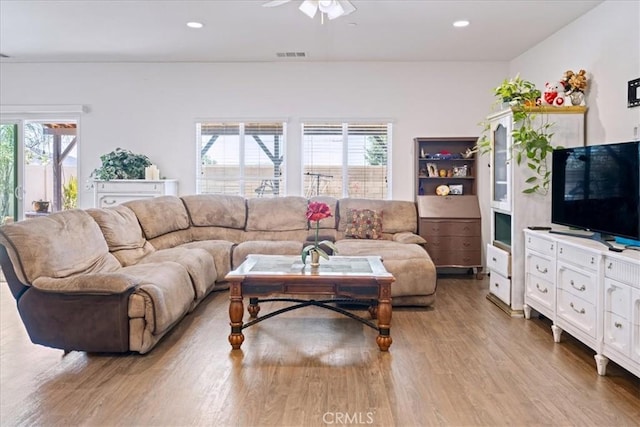 26947 Mountaingate St, Menifee, CA 92585 - living room with light wood-style floors, healthy amount of natural light, a ceiling fan, and recessed lighting