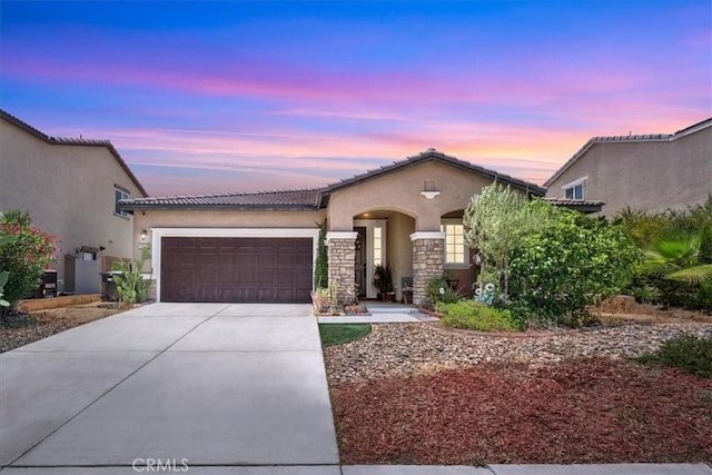 26947 Mountaingate St, Menifee, CA 92585 - mediterranean / spanish house with an attached garage, stucco siding, driveway, and a tile roof