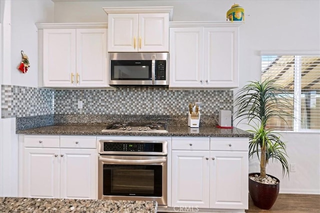 26947 Mountaingate St, Menifee, CA 92585 - kitchen featuring appliances with stainless steel finishes, white cabinets, and decorative backsplash