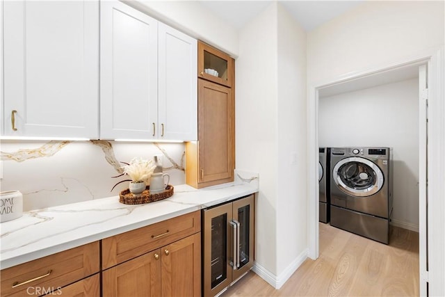 15 Lyon Rdg, Aliso Viejo, CA 92656 - laundry room with beverage cooler, light wood-style floors, and washing machine and dryer