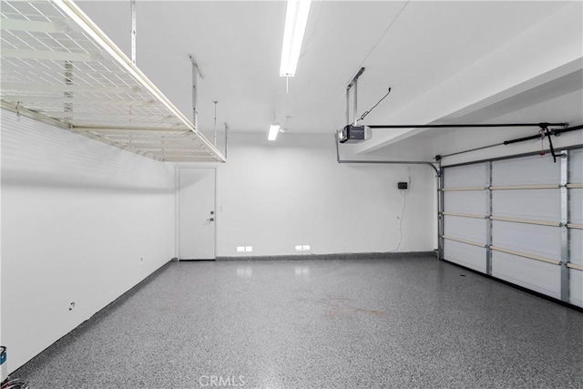 15 Lyon Rdg, Aliso Viejo, CA 92656 - garage with a garage door opener and baseboards