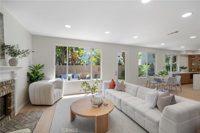 15 Lyon Rdg, Aliso Viejo, CA 92656 - living room featuring light wood-style floors, a fireplace, and recessed lighting