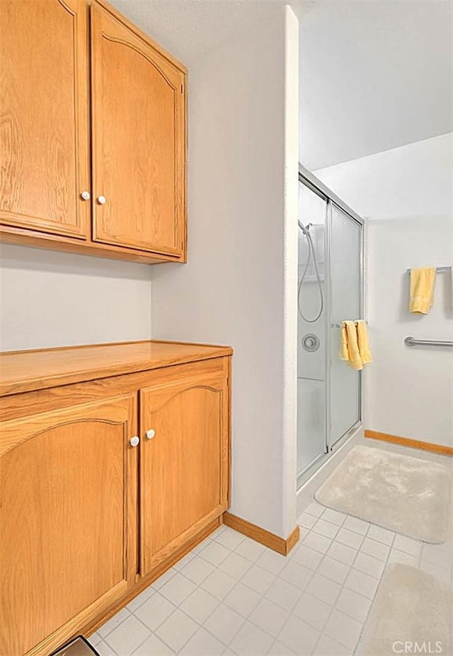 14158 Tu Su Cir, Apple Valley, CA 92307 - bathroom with a shower stall and tile patterned flooring