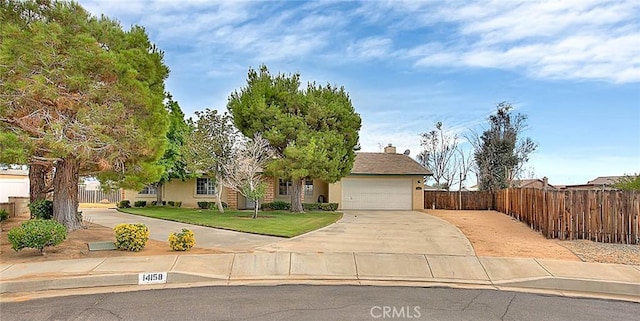 14158 Tu Su Cir, Apple Valley, CA 92307 - view of front of house featuring driveway, an attached garage, stucco siding, and a chimney