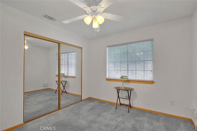 14158 Tu Su Cir, Apple Valley, CA 92307 - unfurnished bedroom with carpet flooring, a closet, and ceiling fan