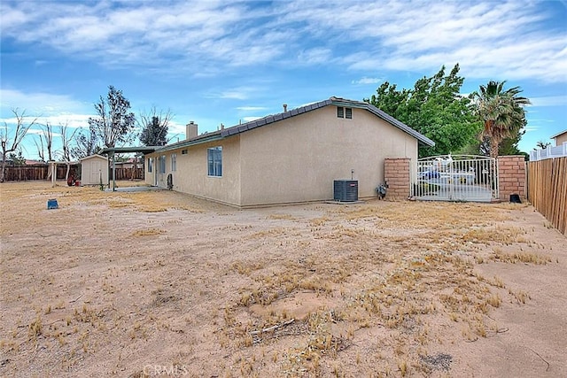 14158 Tu Su Cir, Apple Valley, CA 92307 - view of side of home featuring a shed and stucco siding