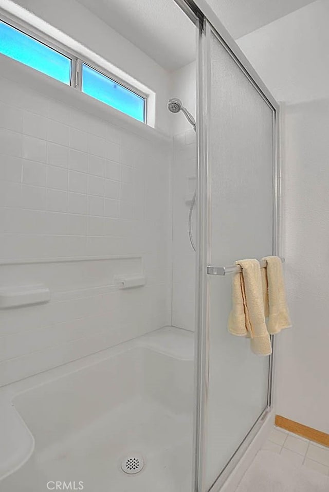 14158 Tu Su Cir, Apple Valley, CA 92307 - full bath featuring a shower stall and tile patterned flooring