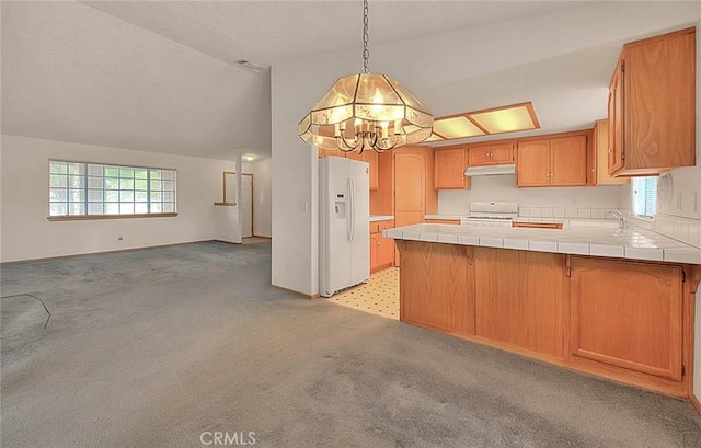 14158 Tu Su Cir, Apple Valley, CA 92307 - kitchen featuring white fridge with ice dispenser, under cabinet range hood, tile counters, stove, and a peninsula