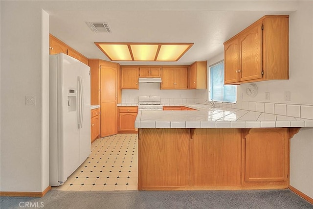 14158 Tu Su Cir, Apple Valley, CA 92307 - kitchen featuring white appliances, a peninsula, under cabinet range hood, light floors, and tile countertops