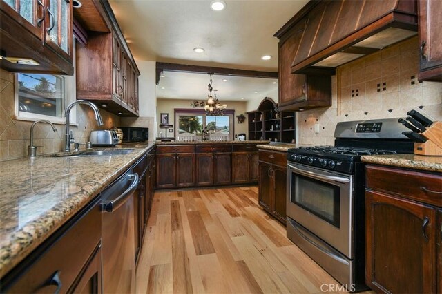 19536 Kittridge St, Reseda, CA 91335 - kitchen with stainless steel appliances, light wood-type flooring, tasteful backsplash, recessed lighting, and a chandelier