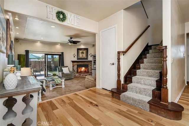 19536 Kittridge St, Reseda, CA 91335 - living area featuring wood finished floors, ceiling fan, stairway, a fireplace, and recessed lighting