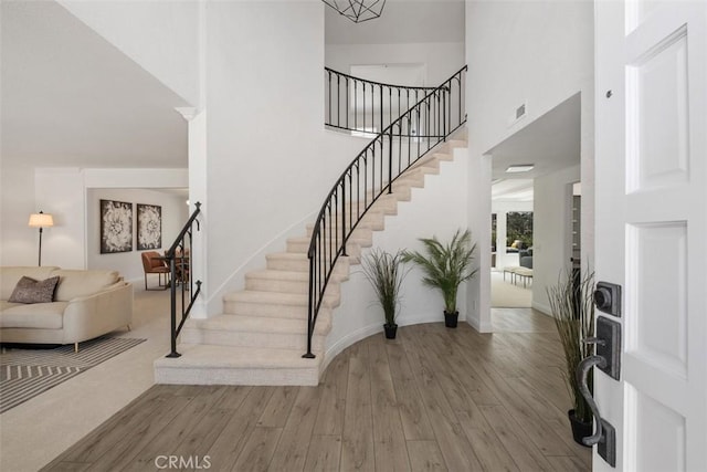26532 Via Marina, Mission Viejo, CA 92691 - foyer featuring stairway, wood finished floors, and a towering ceiling