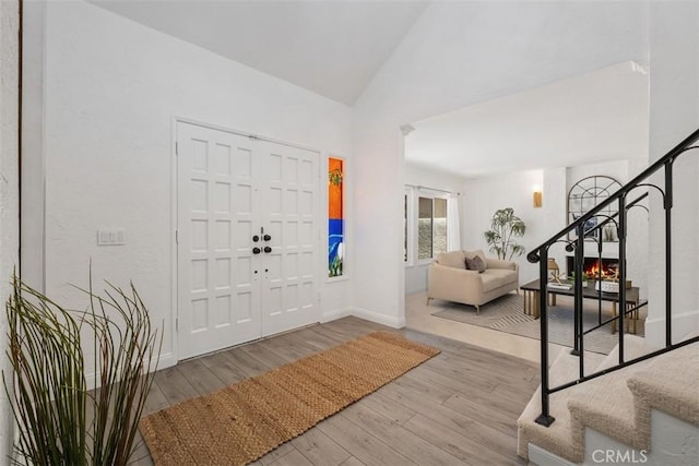 26532 Via Marina, Mission Viejo, CA 92691 - entryway featuring stairway, wood finished floors, and high vaulted ceiling