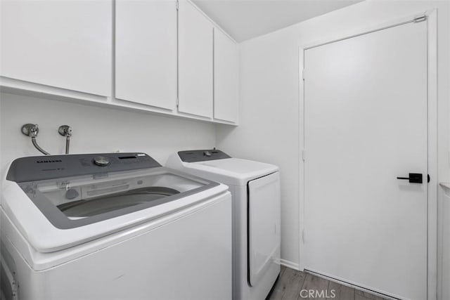 26532 Via Marina, Mission Viejo, CA 92691 - laundry area with washer and clothes dryer, cabinet space, and wood finished floors
