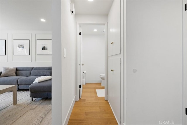 8396 Goldsport Cir, Huntington Beach, CA 92646 - corridor with light wood finished floors and recessed lighting