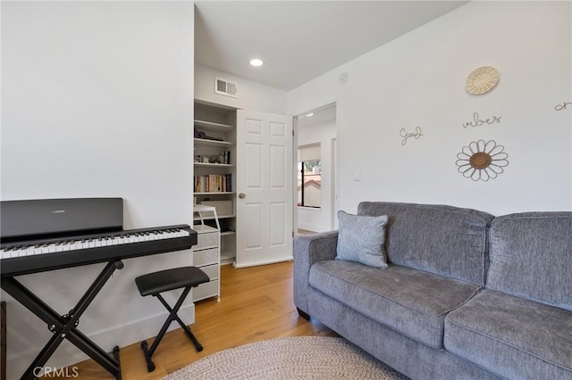 8396 Goldsport Cir, Huntington Beach, CA 92646 - living room featuring light wood-style flooring and recessed lighting