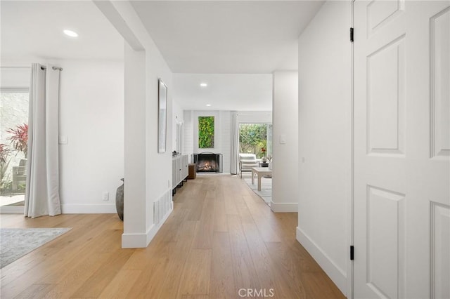 8396 Goldsport Cir, Huntington Beach, CA 92646 - corridor with light wood-style floors and recessed lighting