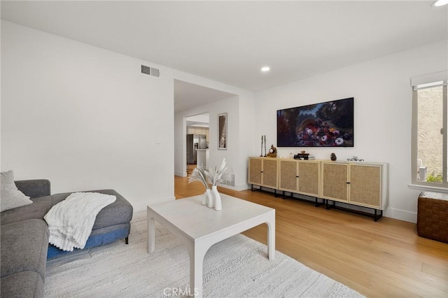 8396 Goldsport Cir, Huntington Beach, CA 92646 - living room with wood finished floors and recessed lighting