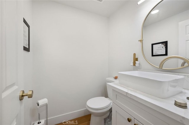 8396 Goldsport Cir, Huntington Beach, CA 92646 - half bathroom with vanity and wood finished floors
