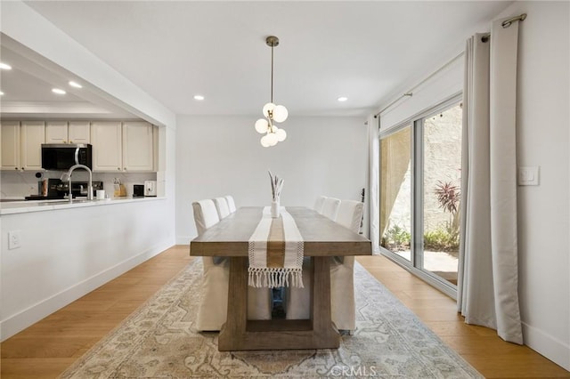 8396 Goldsport Cir, Huntington Beach, CA 92646 - dining area with healthy amount of natural light, recessed lighting, and light wood-style floors