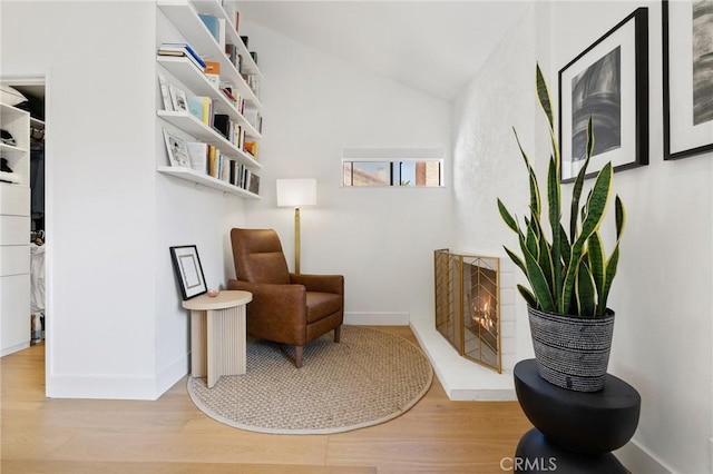 8396 Goldsport Cir, Huntington Beach, CA 92646 - living area featuring wood finished floors and vaulted ceiling