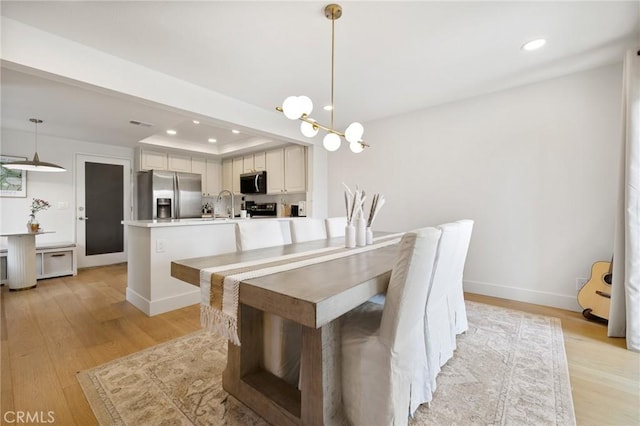 8396 Goldsport Cir, Huntington Beach, CA 92646 - dining room featuring recessed lighting and light wood-style floors