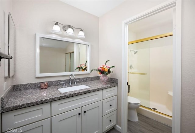 1304 Calle Grande Unit 68, Fullerton, CA 92835 - bathroom with wood finished floors, a shower stall, and vanity