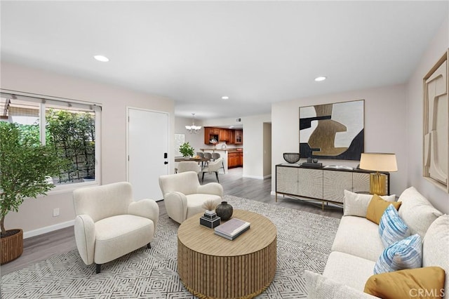 1304 Calle Grande Unit 68, Fullerton, CA 92835 - living area with wood finished floors, recessed lighting, and a chandelier