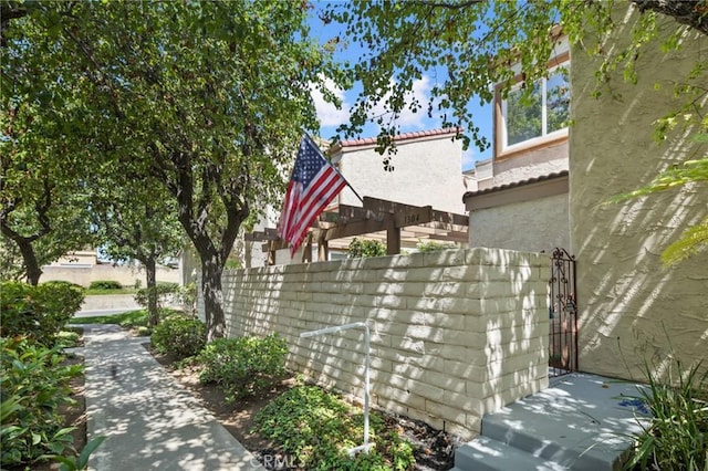 1304 Calle Grande Unit 68, Fullerton, CA 92835 - view of side of home featuring stucco siding