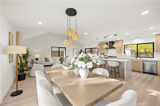 4700 Emerald Ave, La Verne, CA 91750 - dining area featuring light wood-type flooring, vaulted ceiling, and recessed lighting