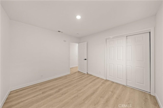 4700 Emerald Ave, La Verne, CA 91750 - unfurnished bedroom featuring light wood finished floors, a closet, and recessed lighting