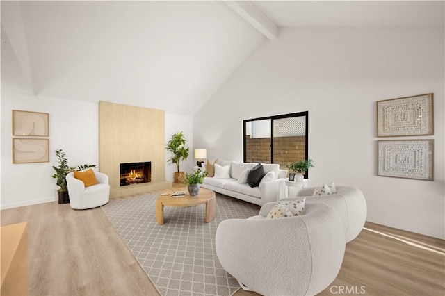 4700 Emerald Ave, La Verne, CA 91750 - living room with beam ceiling, high vaulted ceiling, wood finished floors, and a fireplace