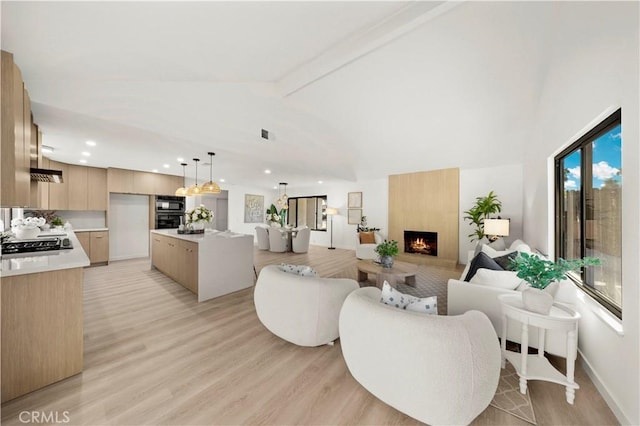 4700 Emerald Ave, La Verne, CA 91750 - living room featuring a large fireplace, recessed lighting, and light wood-style flooring